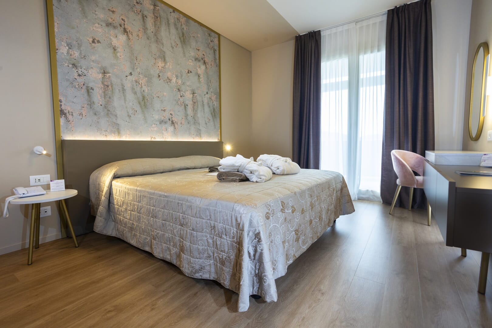 A modern and cozy room with a double bed.