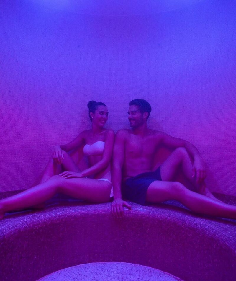 Relax in the sauna, bathed in soft light.
